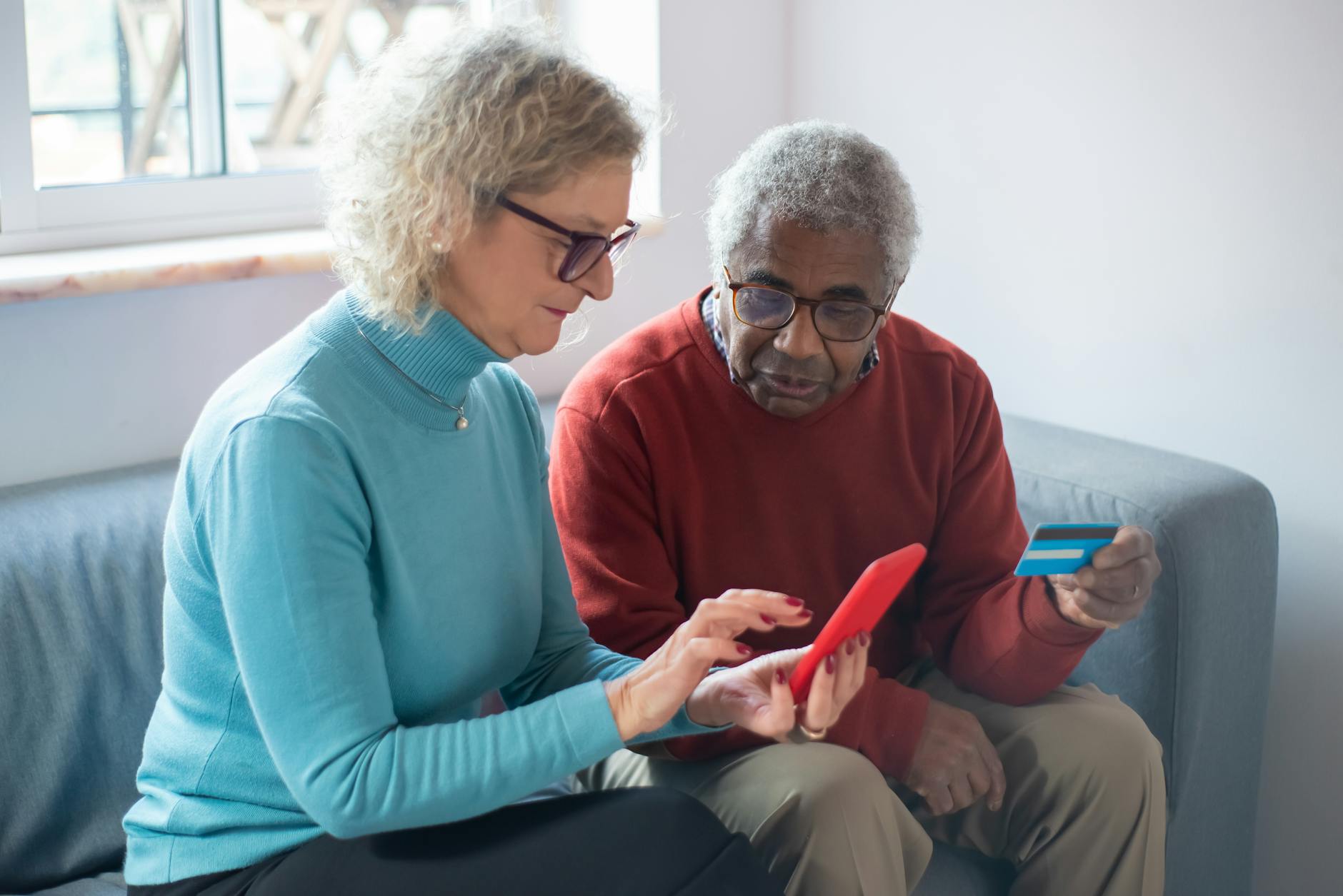 an elderly couple shopping online